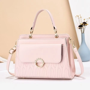 Pink quilted PU leather handbag with elegant wave stitching and pearl buckle detail