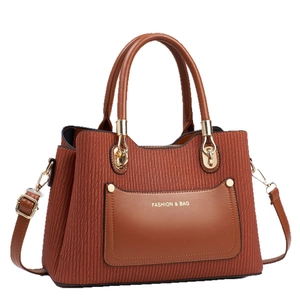 Brown pleated crossbody bag with dual top handles and gold-tone hardware details