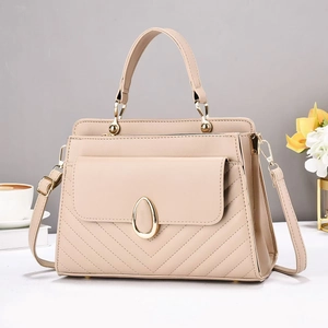 Elegant beige quilted handbag with gold metal clasp and versatile shoulder strap for women