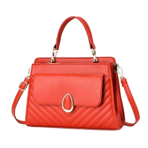 Classic red quilted tote bag with golden hardware and versatile shoulder strap for women