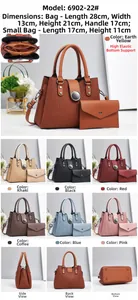 Detail view of two-piece textured leather handbag set with circular metal buckle