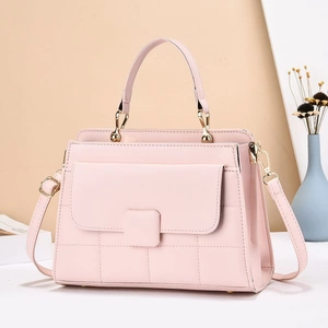 Elegant light pink quilted crossbody bag with gold hardware and top handle for women
