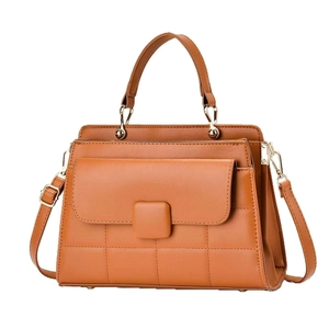 Caramel brown quilted small square crossbody bag with gold hardware and top handle