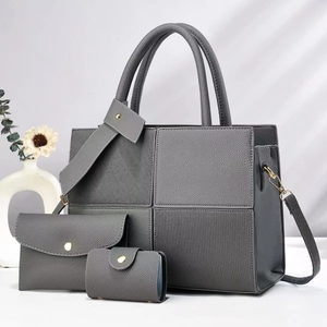 Three-piece grey striped tote bag set with matching clutch and card holder in premium PU