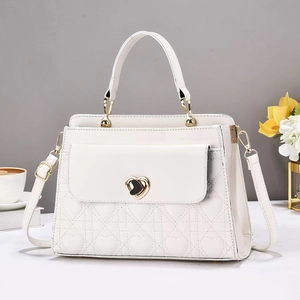 Elegant white quilted heart-shaped crossbody bag with gold-tone hardware and top handle