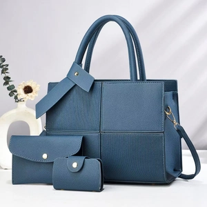 Blue 3-piece striped tote bag set with matching wallet and pouch in textured faux leather