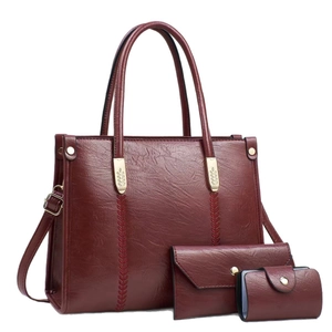 Three-piece wine red tote bag set with stitching detail and adjustable strap