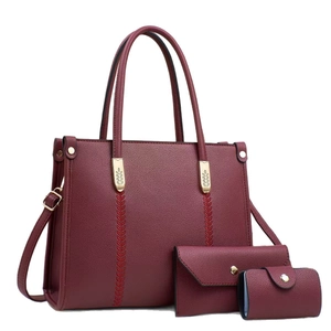 Chic burgundy 3-piece handbag set featuring a tote with golden leaf accents and pebble texture