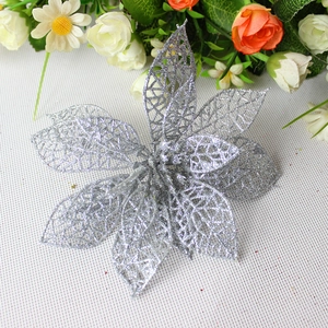 Close-up of silver glitter artificial flower with hollow mesh petals for Christmas decor