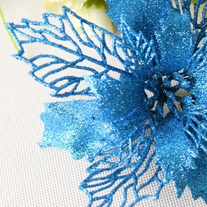 Close-up of a 16cm blue glitter hollow artificial flower for Christmas tree decoration