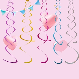 Close-up of colorful ceiling foil swirls with pink heart and star party decorations