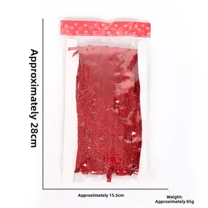 Red tinsel fringe curtain packaging showing dimensions 28cm by 15.5cm and 85g weight