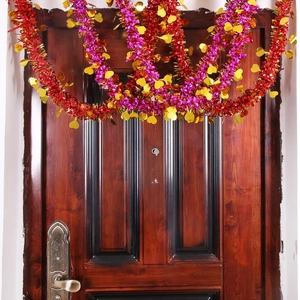 Red and purple tinsel garland with golden hearts for Valentine's Day party decoration