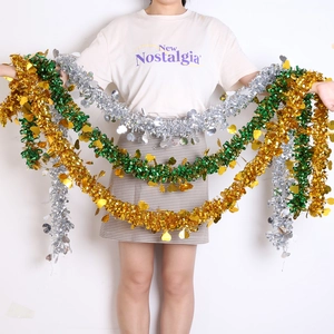 Thick colorful tinsel garland with heart sequins in metallic gold, green and silver colors