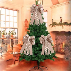 Three rustic faux linen Christmas bows with white polka dots on a green festive tree