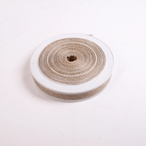 Detailed close-up of natural jute ribbon roll with white lace trim for DIY holiday crafts
