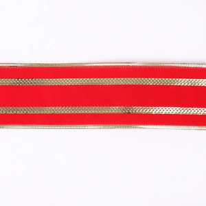 Close-up of red velvet Christmas ribbon featuring two parallel golden metallic stripes