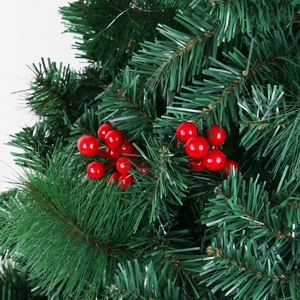 Close-up of realistic red foam berries and green pine needles for DIY Christmas decor