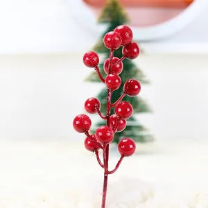 Macro detail of red artificial foam berries for Christmas tree DIY decoration
