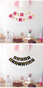 Λεπτομέρεια από ροζ και μαύρες πανό Happy Birthday με χρυσά μεταλλικά γράμματα