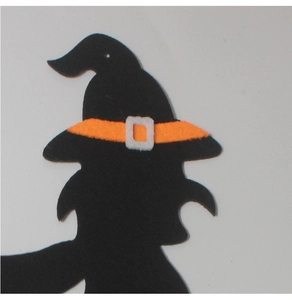 Detail of Halloween witch hat silhouette made of black felt with orange ribbon