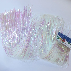 Iridescent Christmas tinsel garland with colorful ribbon strands for festive party decor
