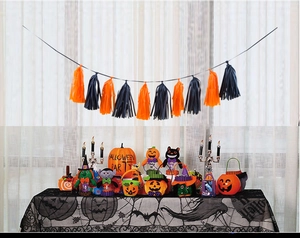Detailed Halloween decor set featuring orange and black tassels with spooky plush dolls