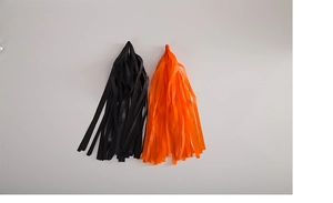 Close-up of black and orange decorative tassels for Halloween party backdrop decoration