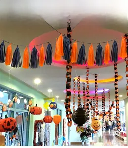 Close-up of orange and black Halloween tassel garland for festive party wall decoration