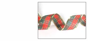 Detailed macro shot of red and green plaid Christmas ribbon with gold metallic edges