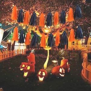 Halloween party tassel garland with orange and black fringe for festive background decor