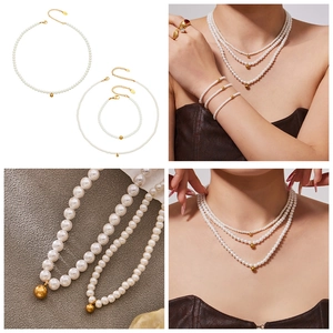 Detailed macro view of bead pearl necklace set with golden pendant and lobster clasp