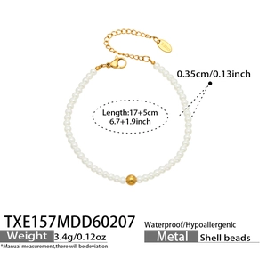 Detail of beaded shell pearl bracelet with golden stainless steel clasp and extender