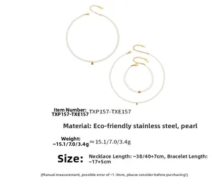 Detail view of pearl jewelry set including gold stainless steel necklaces and bracelet