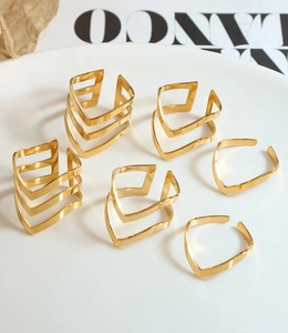 Detailed set of six adjustable gold V-shape rings with minimalist geometric layering