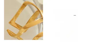 Detailed close-up of rose gold hollowed geometric ring with polished metallic finish