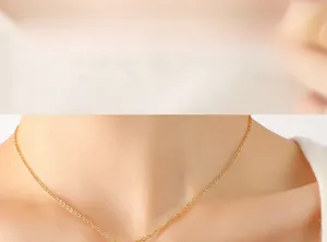 Close-up of minimalist gold 18K titanium steel thin chain necklace on model neck