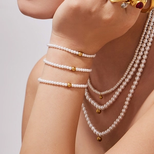 French chic pearl jewelry set with stainless steel beads featuring necklaces and bracelets