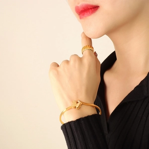 Elegant gold butterfly bracelet and twisted ring set with sparkling zircon stone