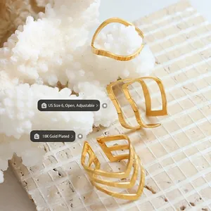 Set of three 18K gold plated stackable rings with wave and geometric adjustable designs