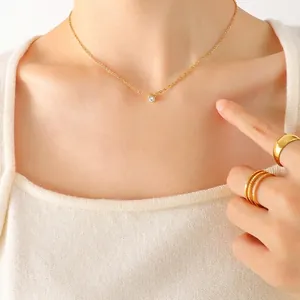 Minimalist 18K gold plated titanium necklace with round zircon solitaire pendant on model