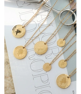 Detail of 18K gold-plated queen portrait coin necklaces with various pendant sizes