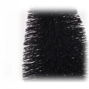 Detail of glitter powder coating on black mini pine needle artificial Christmas tree