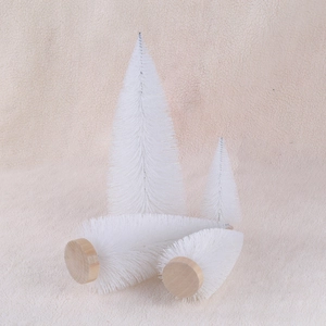 Set of four white mini bottle brush Christmas trees with natural wood bases for tabletop
