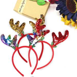 Festive Christmas reindeer antler headbands with shiny sequins and holly leaf decorations