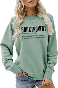 Detail of the Booktrovert definition print on a green long-sleeved crewneck sweatshirt