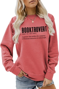 Close-up of Booktrovert text print on coral red long sleeve crewneck sweatshirt for women