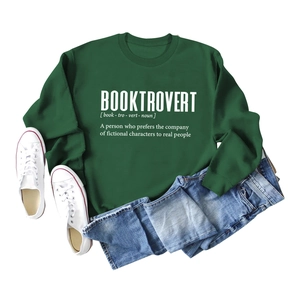 Flat lay of dark green crewneck sweatshirt featuring a white Booktrovert definition print