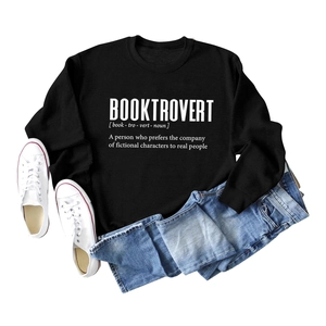 Flat lay of black Booktrovert sweatshirt with denim jeans and white canvas sneakers