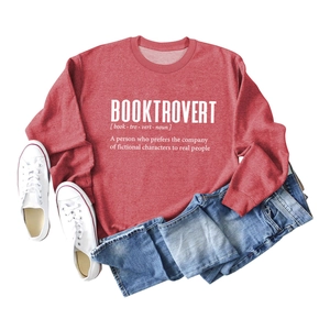 Flat lay of red Booktrovert long sleeve sweatshirt with creative white typography